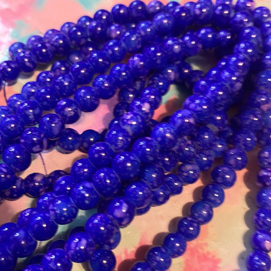 Dark blue in pink glass