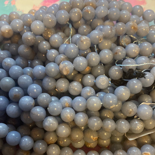 Dark blue in brown jade
