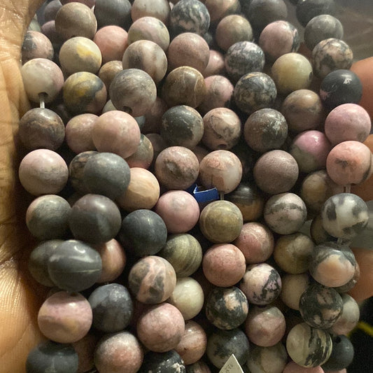 Pink in black rhodonite beads