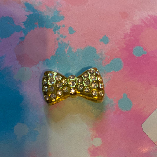 Gold bow charm